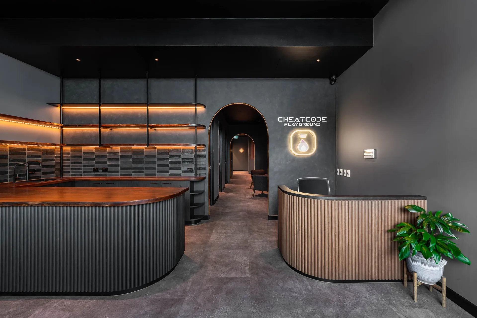 Warmly lit reception and lounge inside Cheat Code Playground in Fortitude Valley